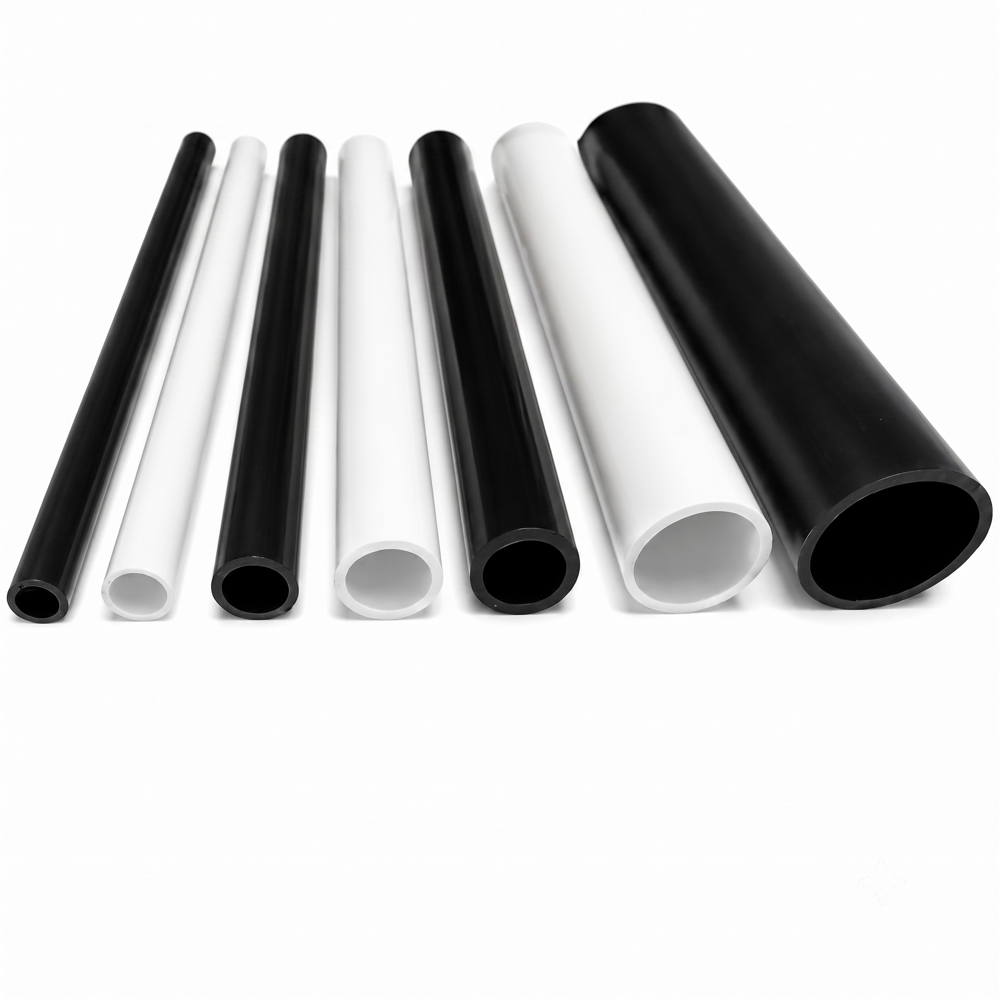 Rigid PVC round tubes in white and black, showing open bore ends and multiple sizes, UK made by Plastic Profile Supplies