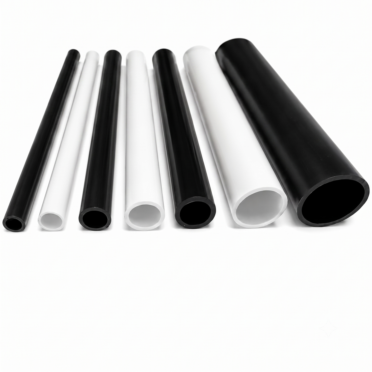 Rigid PVC round tubes in white and black, showing open bore ends and multiple sizes, UK made by Plastic Profile Supplies