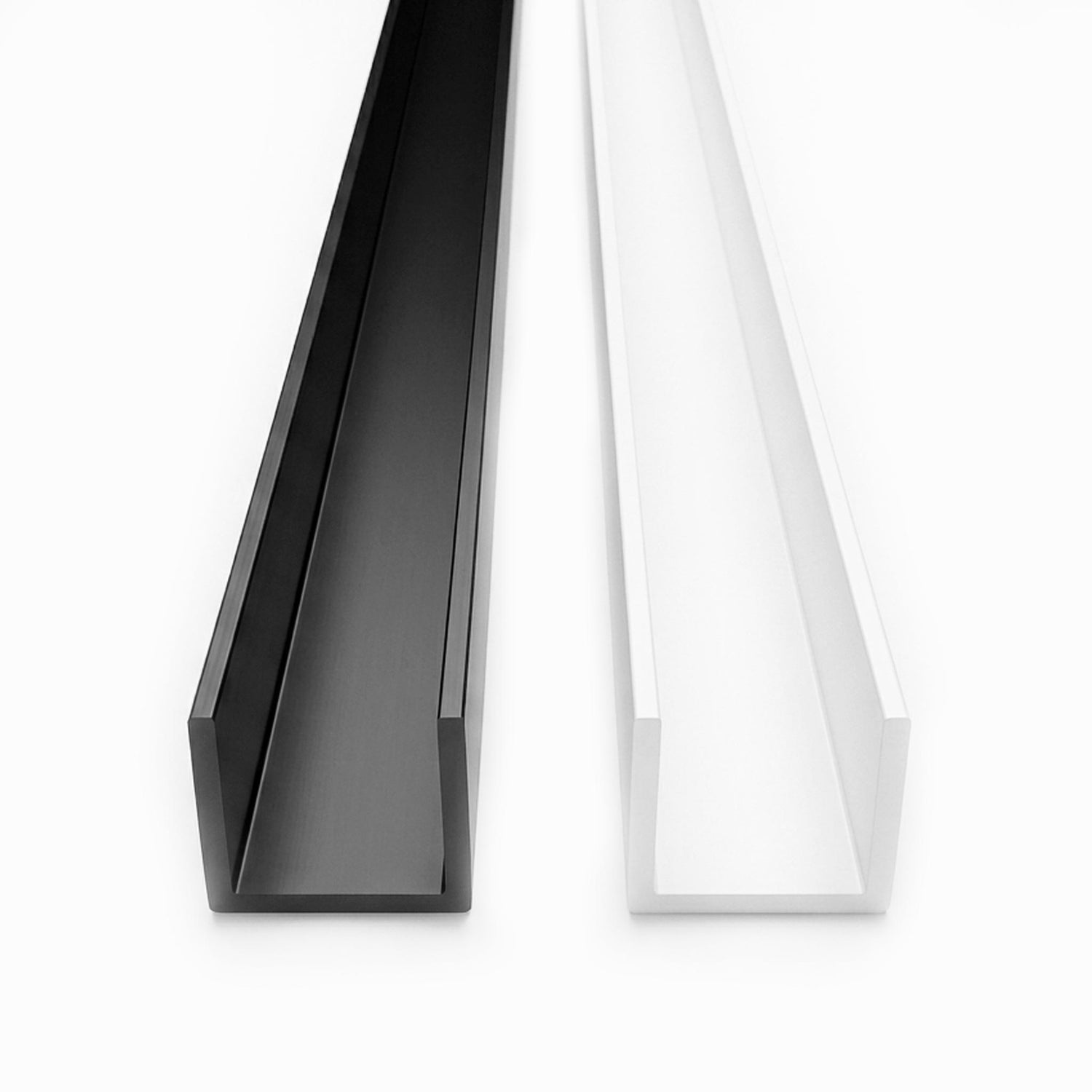Blamck and white rigid white PVC U channel plastic edge trim profile protection strip 1 metre length on a white background. 